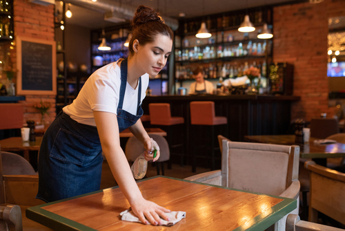 Waitress cleaning 