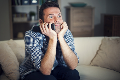 A man watching TV and he is not looking for Ramadan jobs