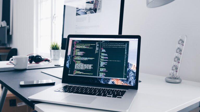AI professional building their portfolio on a laptop